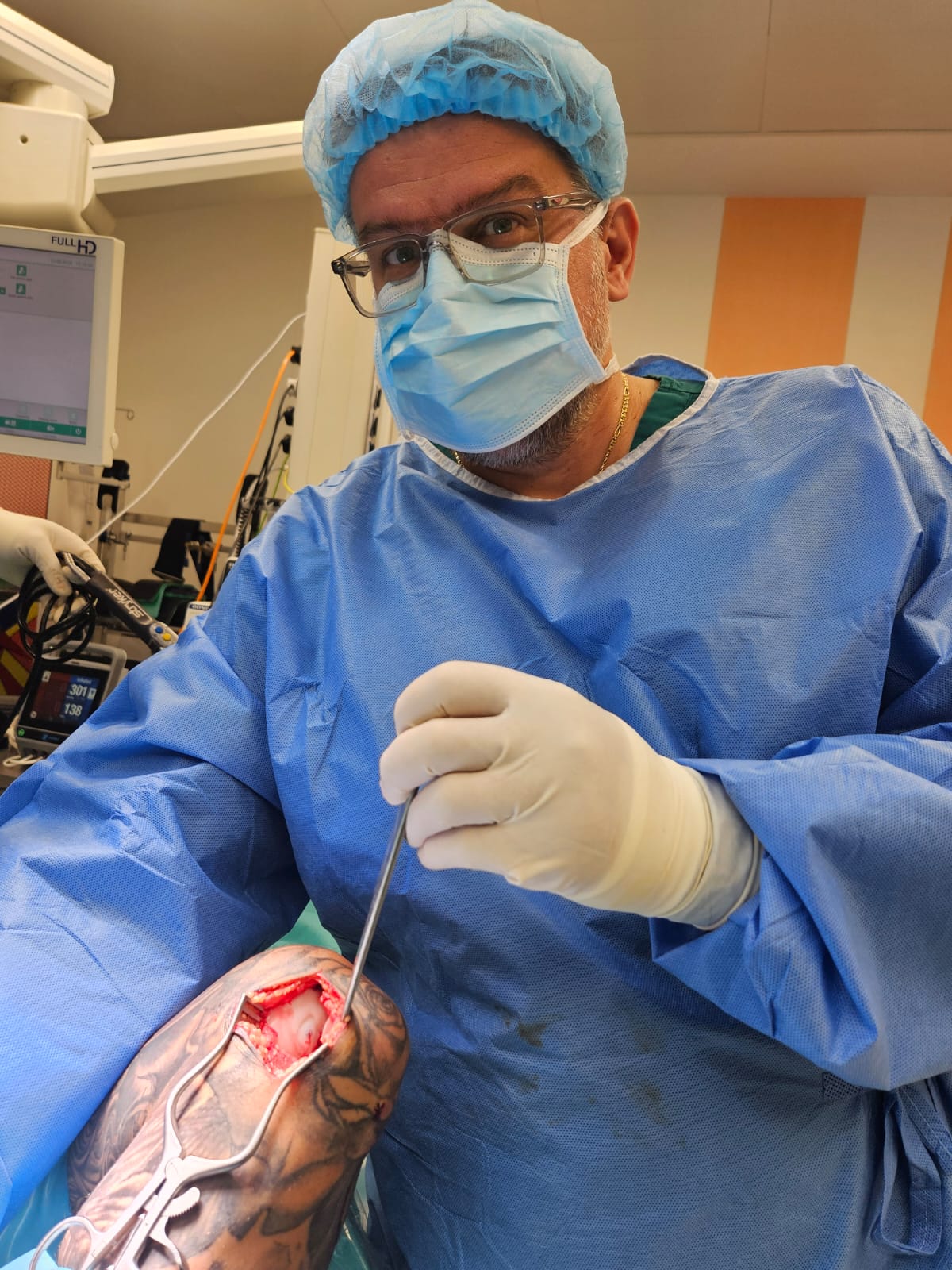 Dr George Konstantinidis performing orthopaedic surgery